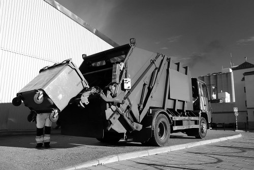 Operatives segregating recyclable and non-recyclable office waste